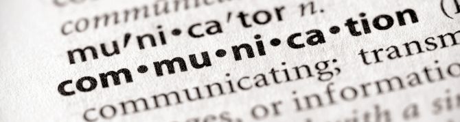 close up view of a dictionary page, showing the word Communication 