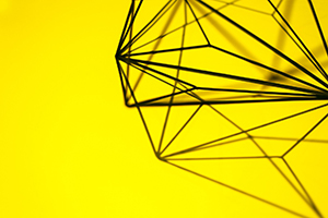 Wire sculpture on yellow background