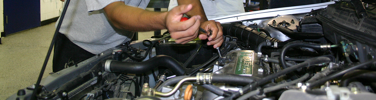 Man working on car engine