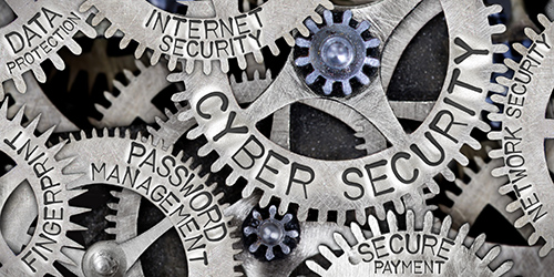 decorative image of wheel cogs with cybersecurity related words written on them