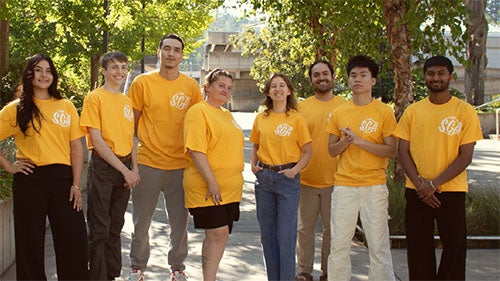 Achieving the Dream Network Connection newsletter cover showing students standing together outdoors in Achieving the Dream shirts.