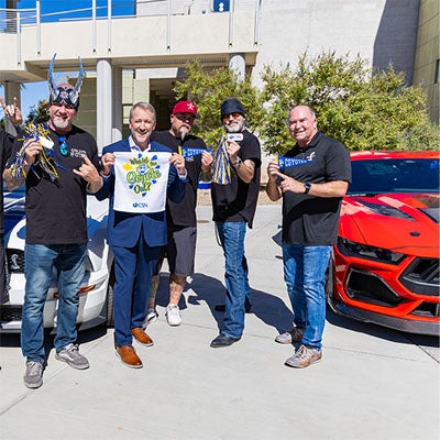Cody the Coyote Day: President Klippenstein stands with community members during Cody the Coyote Day.
