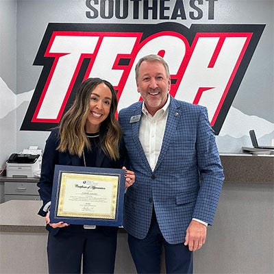 Southeast Technical Campus Tour: President Klippenstein stands with a student during a Southeast Technical Campus tour.