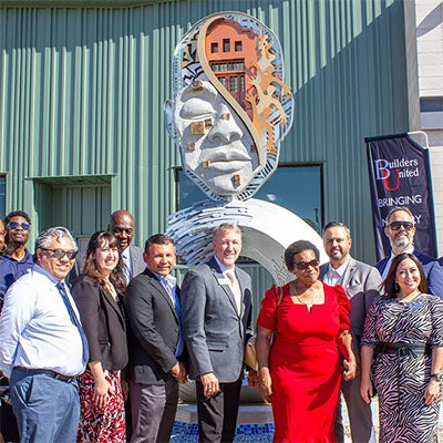 WETC Sculpture Unveiling: President Klippenstein joins community members at the WETC sculpture unveiling.