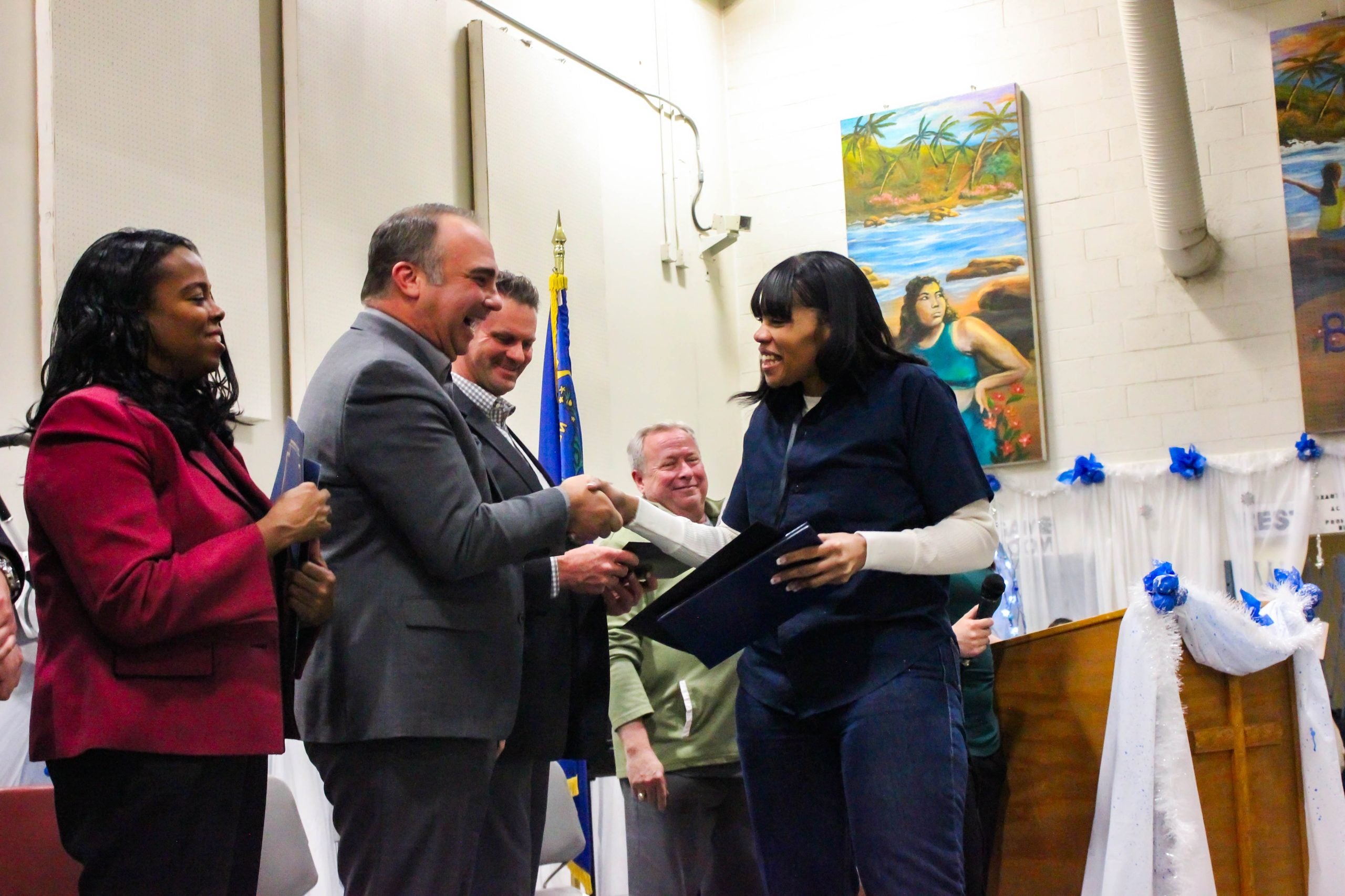 Successful graduation, student receiving certifcate