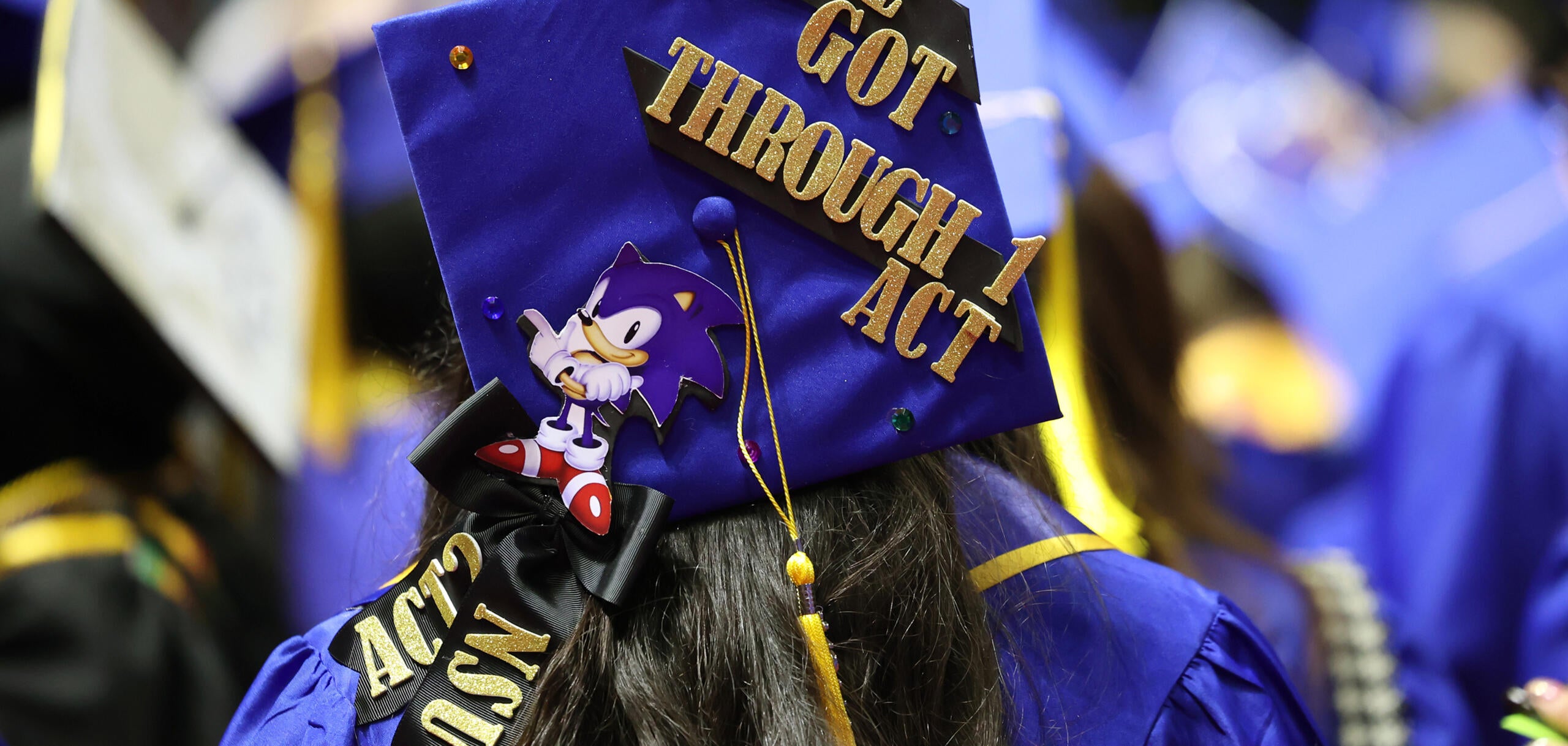 A CSN graduate’s decorated cap highlights academic success and the next step at NSU during a commencement ceremony.